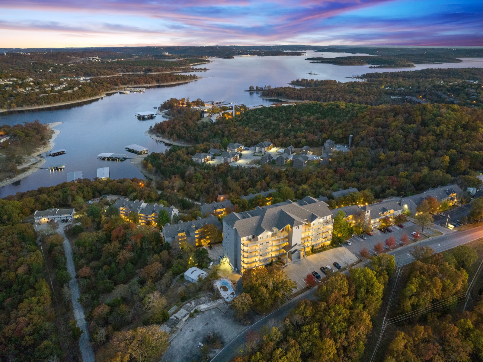 Aerial drone view of a Branson lakefront property at sunset